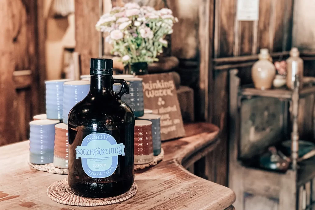 Hobbiton Green Dragon bench with bottle.