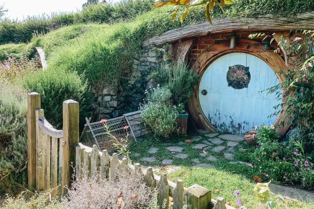 Hobbiton garden and blue door.