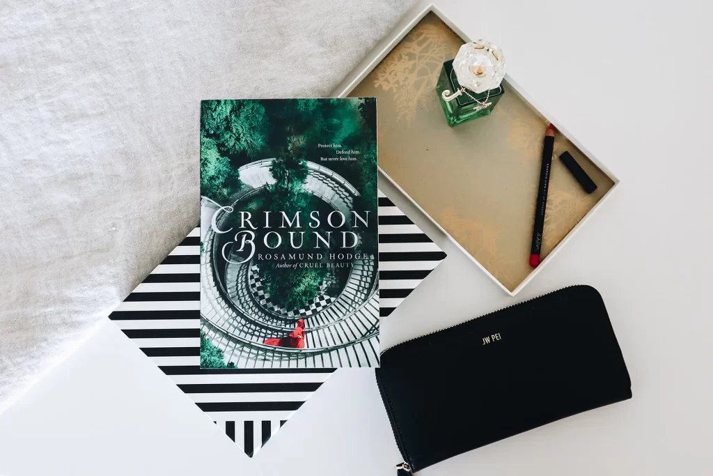 How to Write a Compelling Book Synopsis: synopsis example of Crimson Bound by Rosamund Hodge.