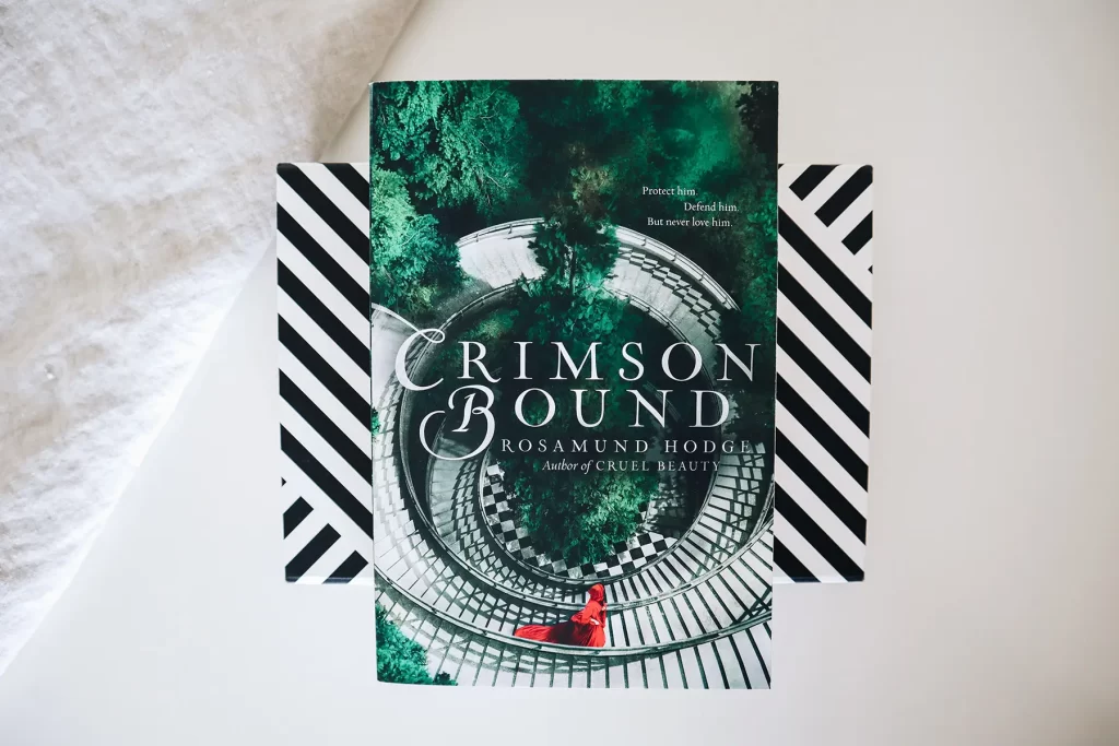 How to Write a Compelling Book Synopsis: synopsis example of Crimson Bound by Rosamund Hodge.