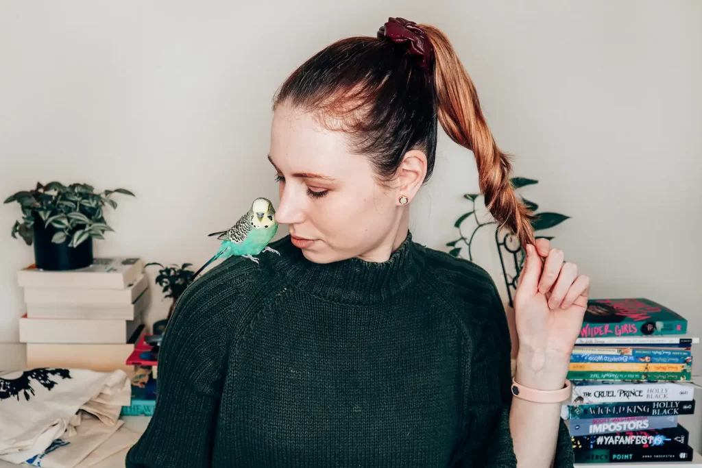 Elle McFadzean and Percy budgie bird.