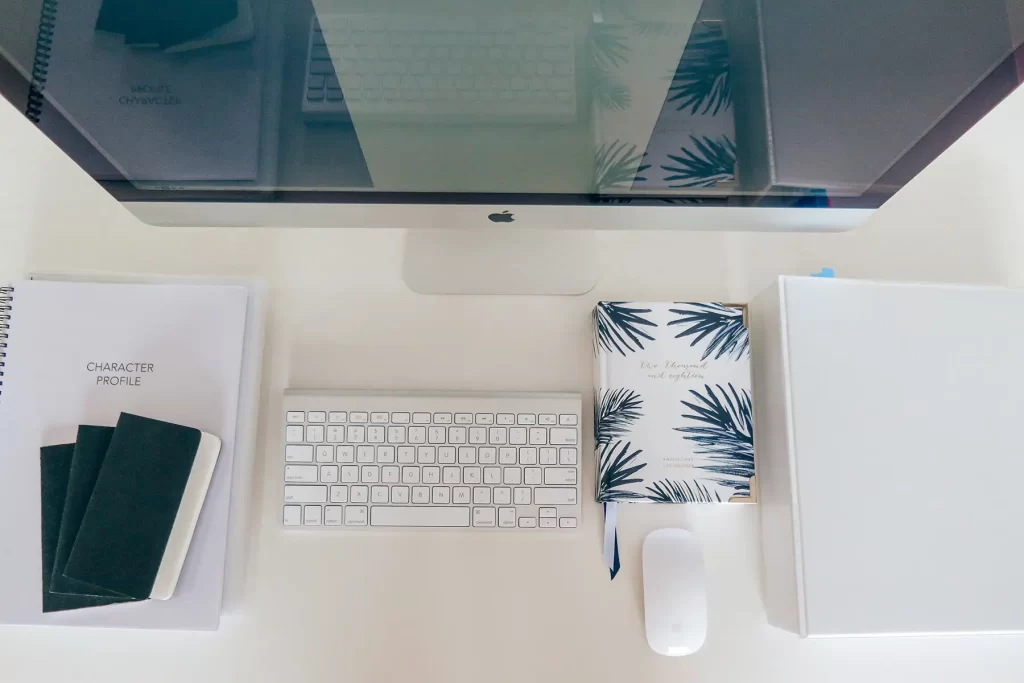 Desk flatly with keyboard and diary.
