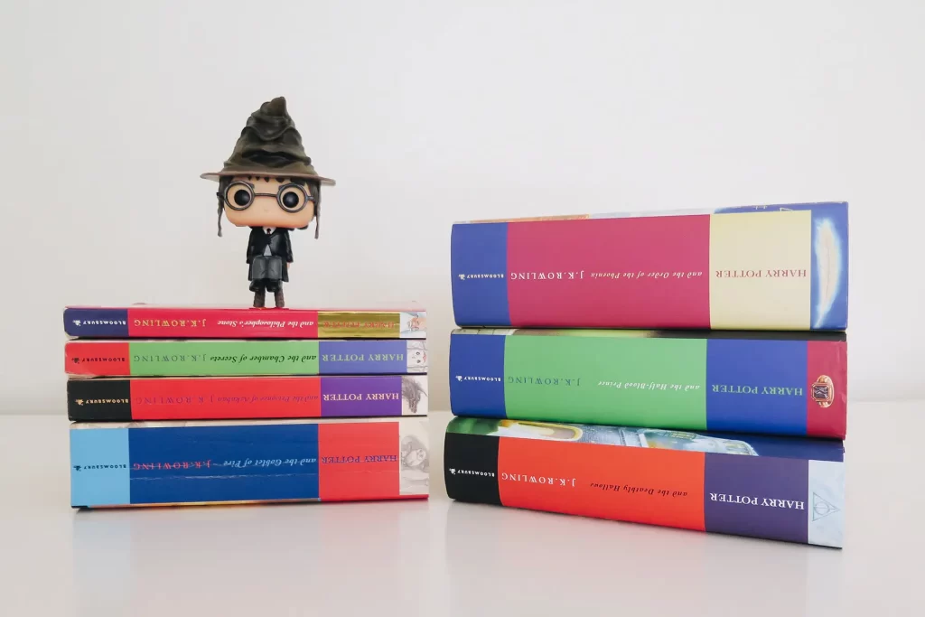 Harry Potter book stack with Harry sorting hat Funko Pop.