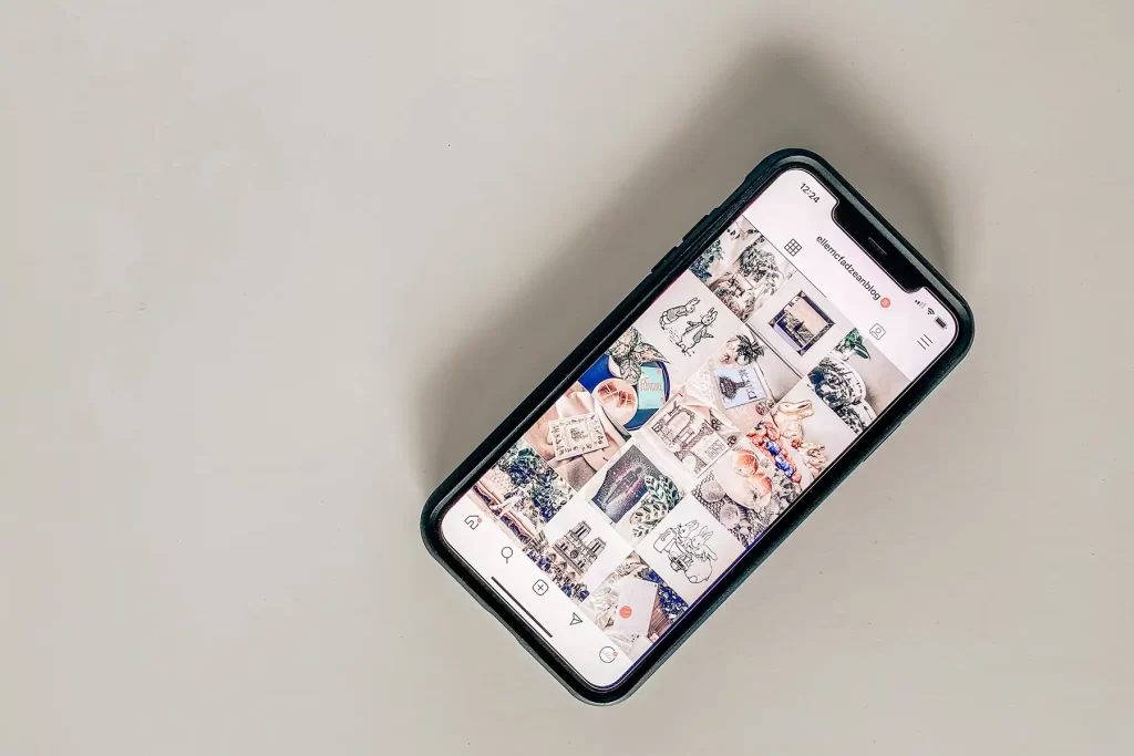 Phone displaying Instagram account.