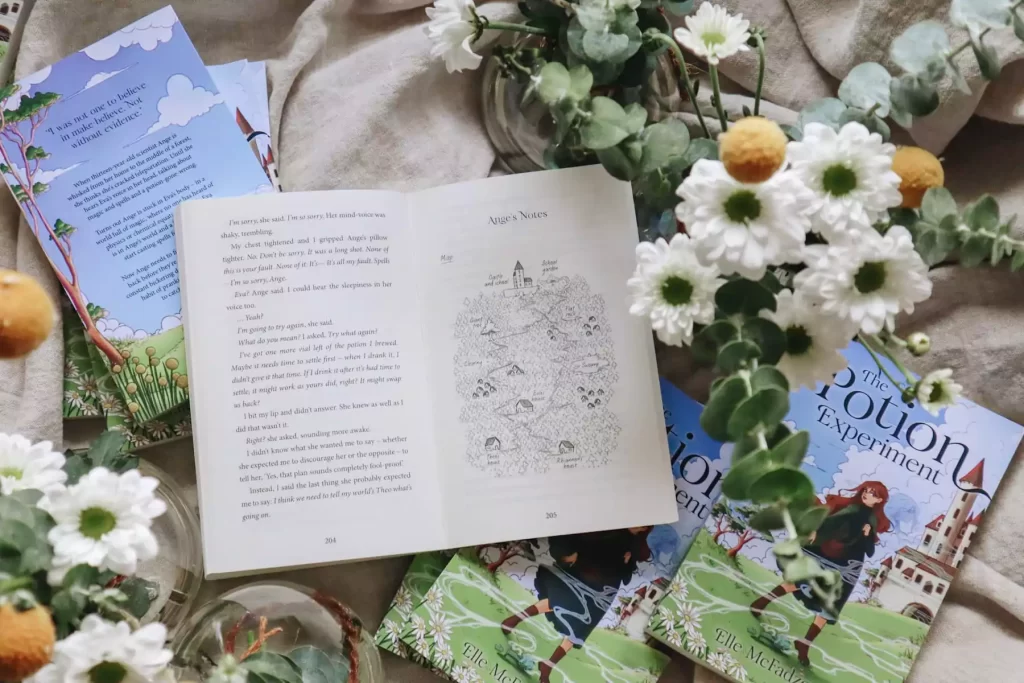 The Potion Experiment books surrounded by flowers
