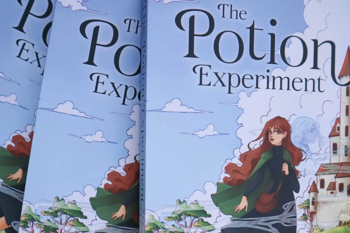A stack of The Potion Experiment books showing the title on the cover